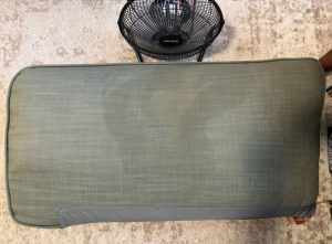 Fabric sofa mid-clean showing soup stain and air mover during drying - BreezeCo Kelowna